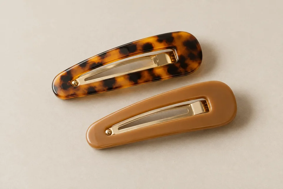 Pair of matte tortoiseshell-look snap clips